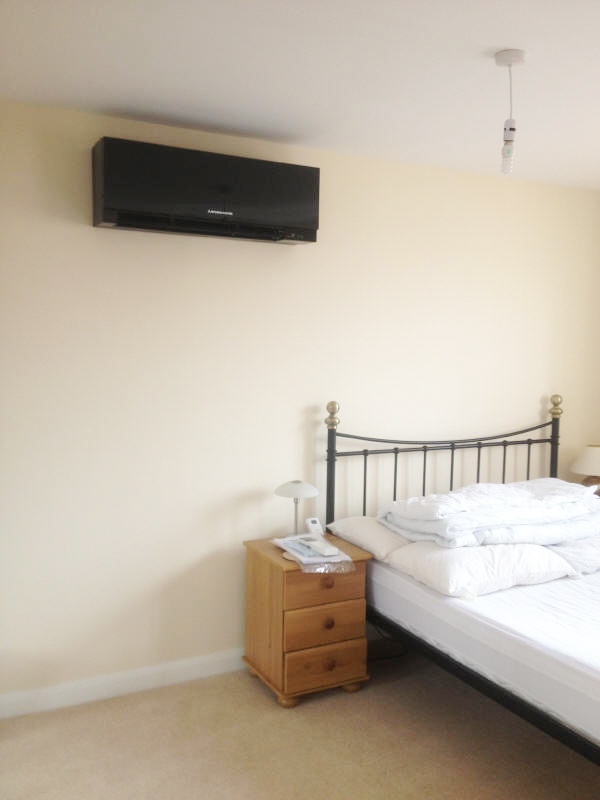 Artistic wall air conditioning unit for a bedroom
